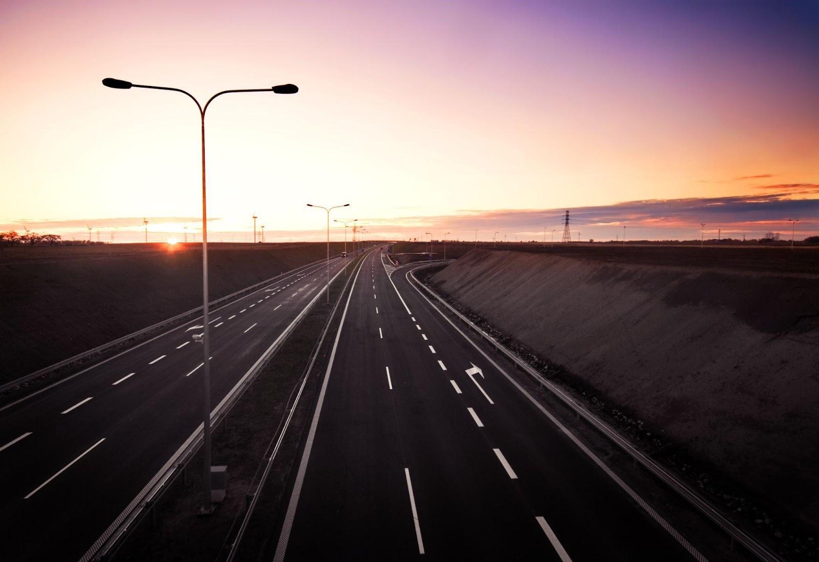Empty highway at sunrise
